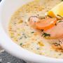 Finnish fish soup with melted cheese